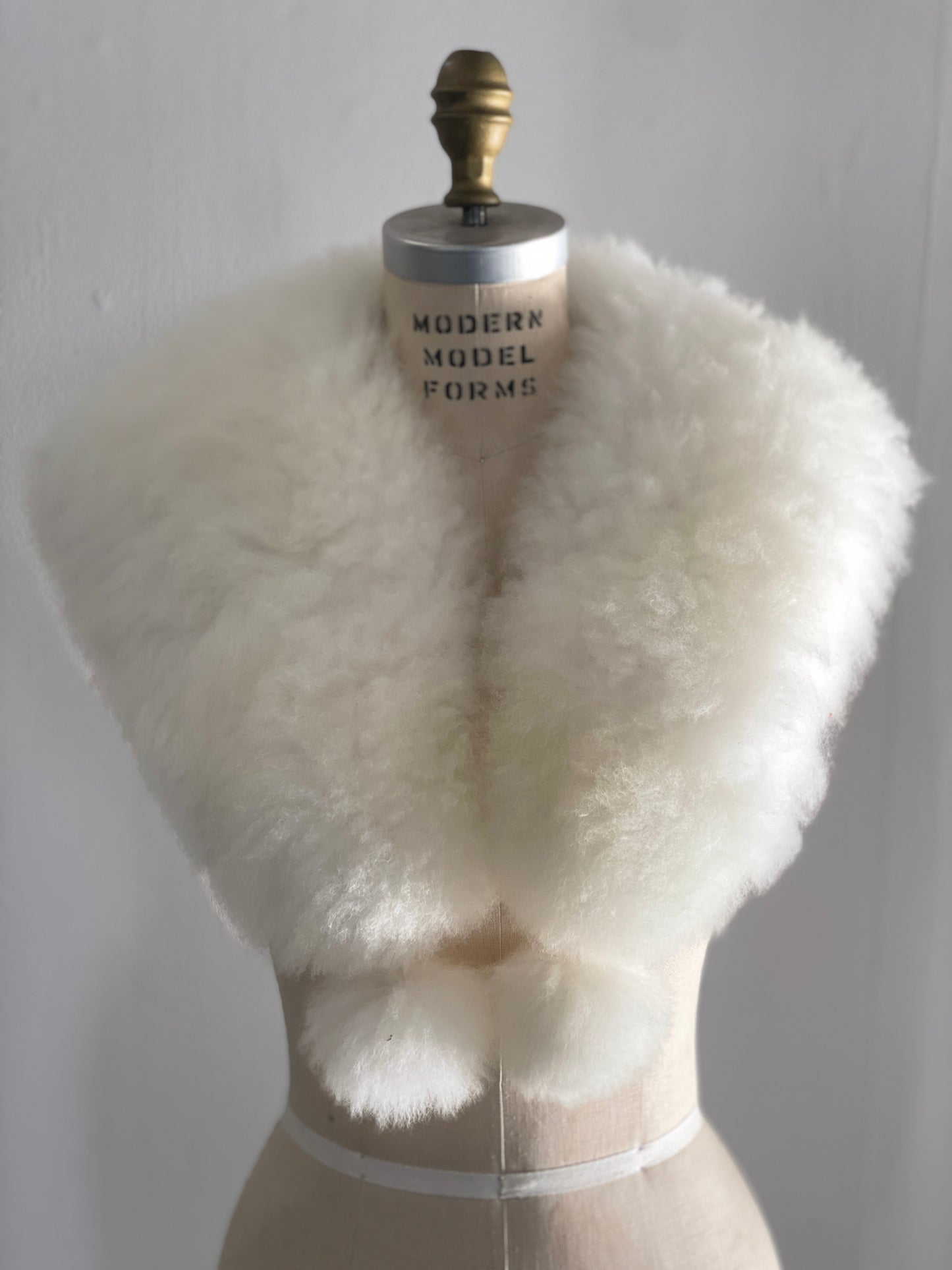 alpaca stole with pom poms